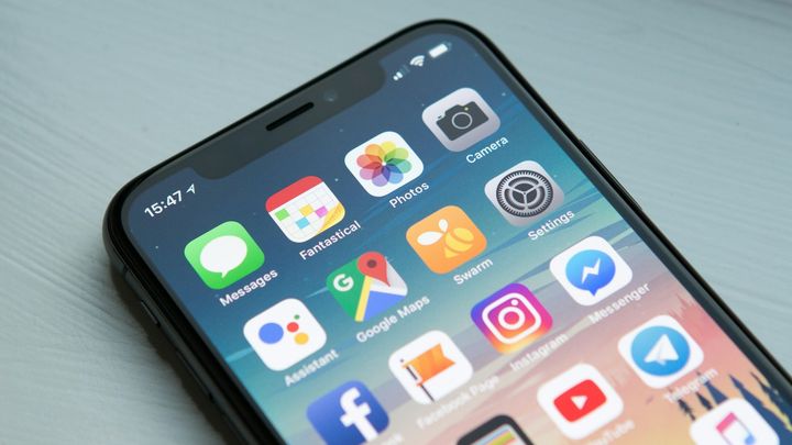 A smartphone home screen full of apps