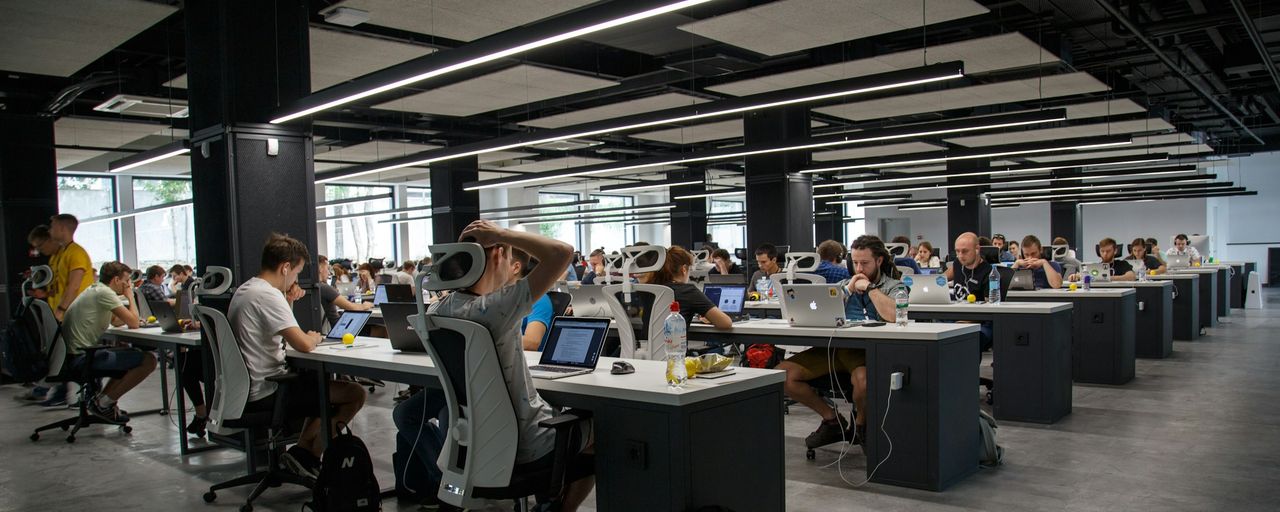 People working at desks in an open-plan office