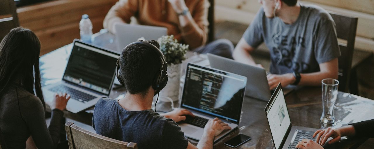 A small team working together on laptops